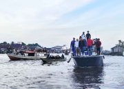 Lestarikan Tradisi, Masduki Ikut Perang Air di Sungai Jelai 
